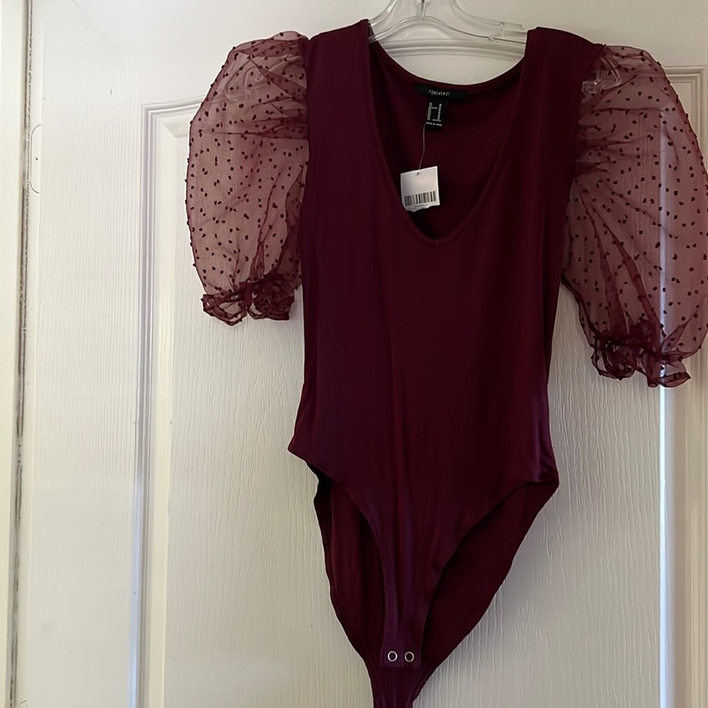 Sheer puff sleeve bodysuit.